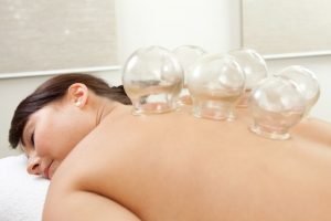 Glass cups on females back